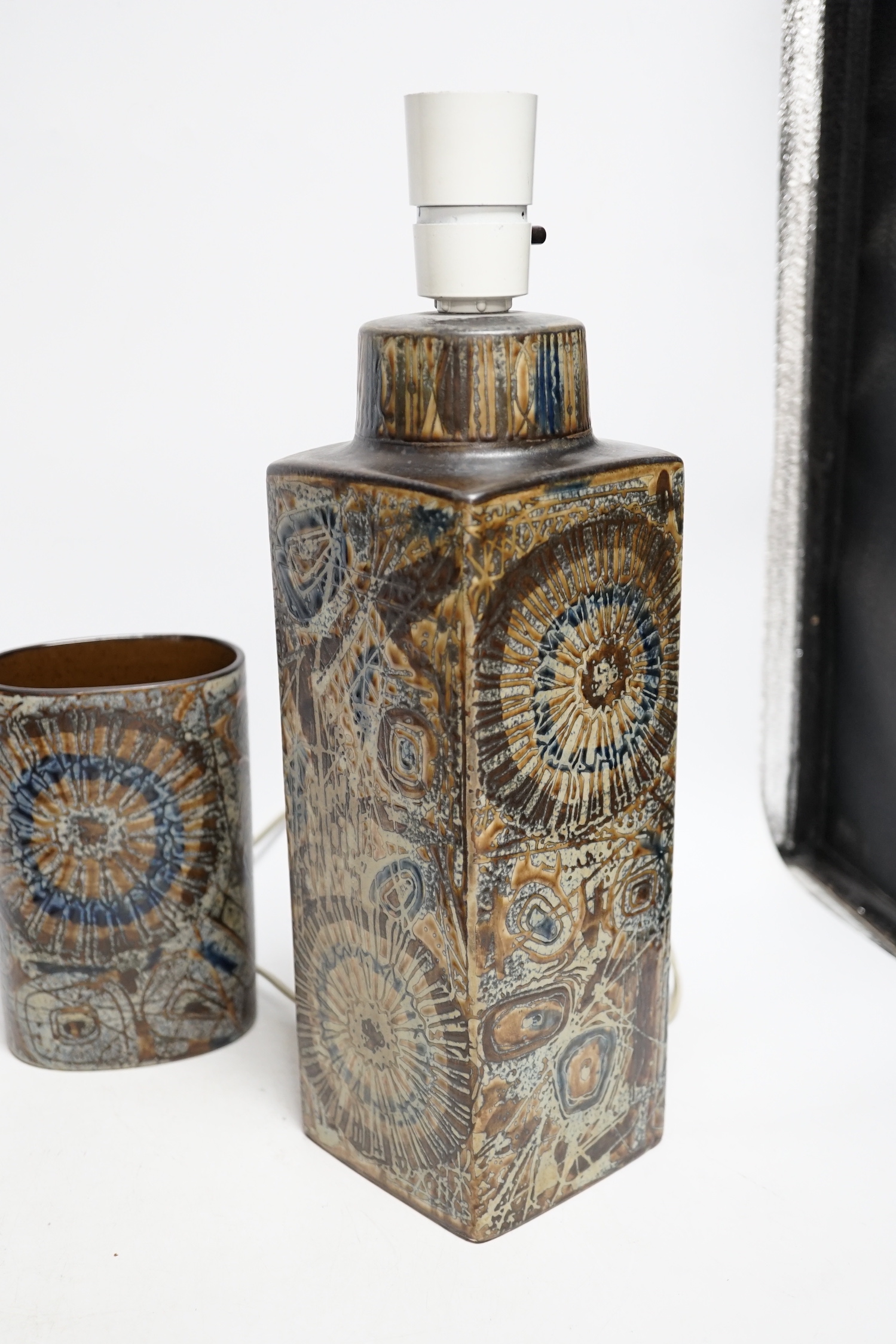 Five Royal Copenhagen fajance items; a lamp, two vases, and two shallow dishes, tallest 29cm